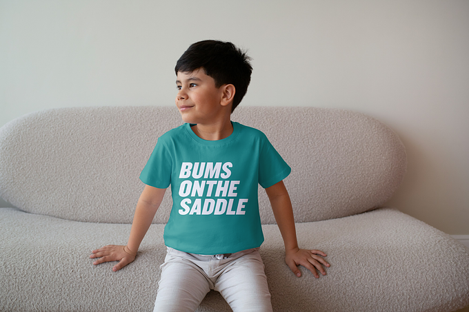 BUMSONTHESADDLE Kids T-shirt (Teal Green/White)